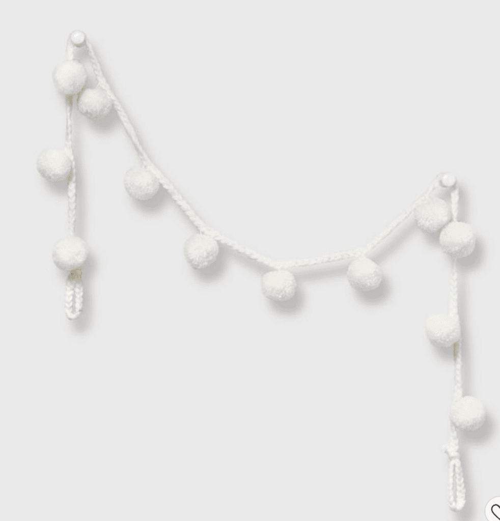 This Neutral Pom Pom Christmas Garland is the perfect addition to a boring doorway, hallway, mantel, shelves, or your Christmas tree. You can purchase this garland from Target for $10.