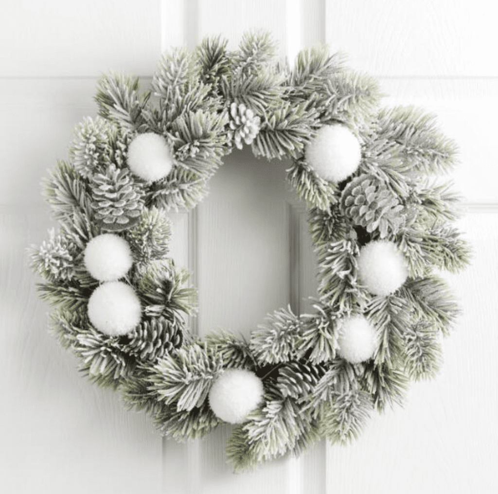 Here is another super cute wreath option. The white snowballs and pinecones give it its character. This wreath is more expensive than the one from Walmart. It is from World Market where you can purchase it for $29.99. Very Neutral!