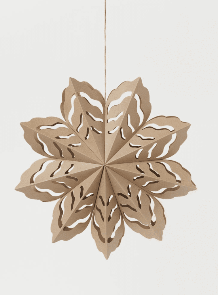 Paper snowflakes are in this year! So many stores have these trendy snowflakes. This large paper snowflake is from H&M and sells for $14.99. It would look great hanging on some decorative branches. Very Neutral!!