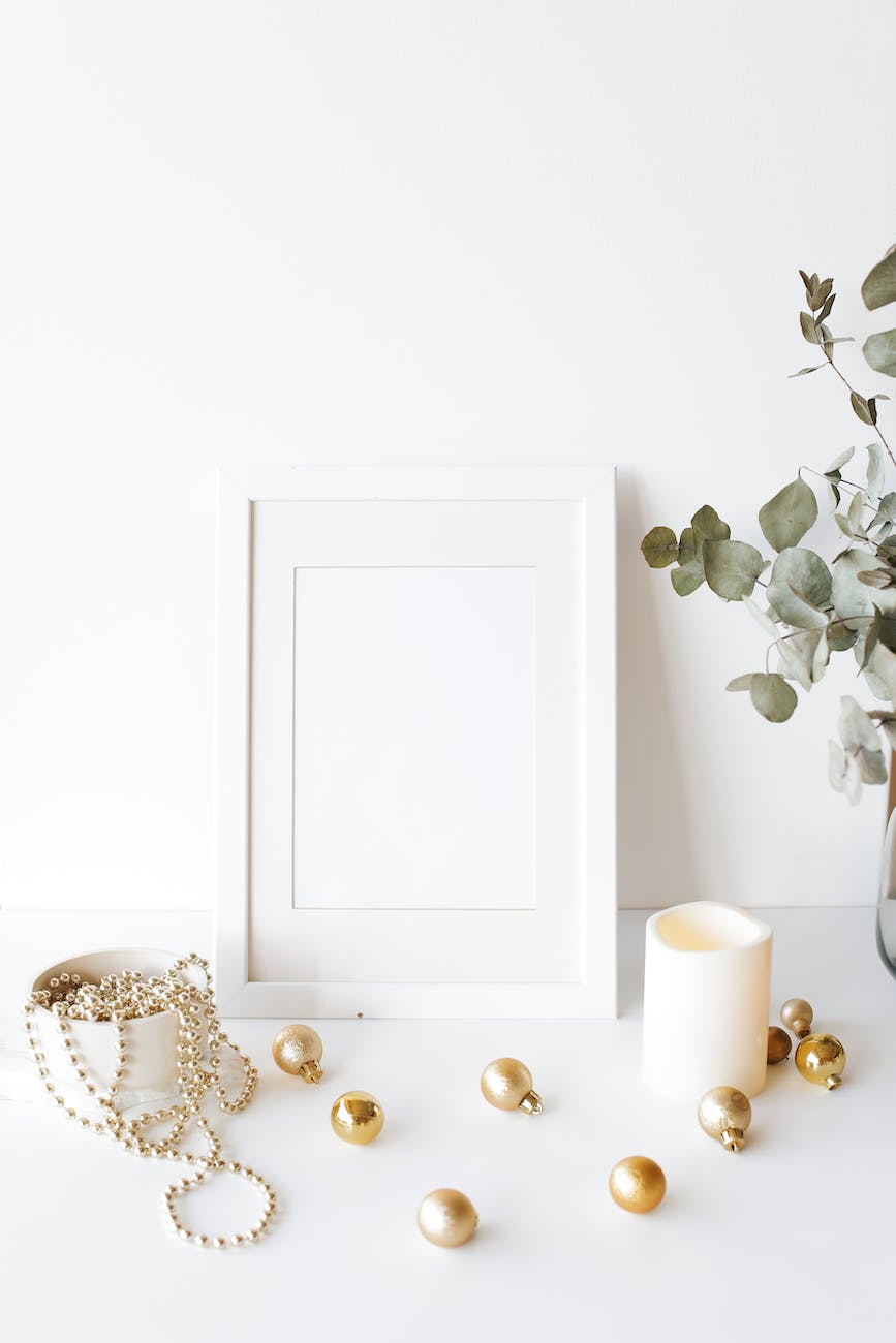 empty photo frame on desk near christmas tree decorations